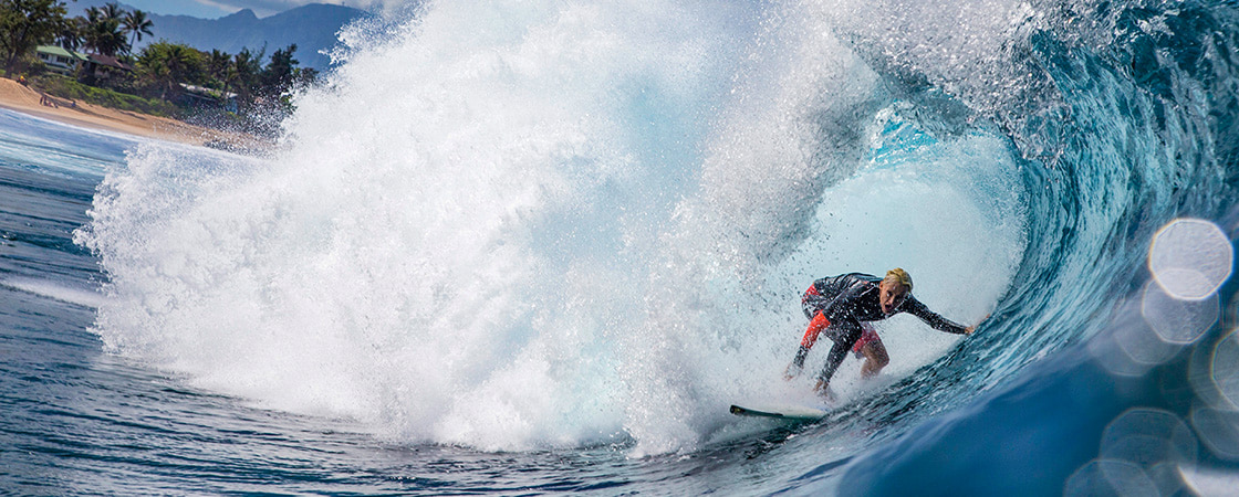 Photo of a surfer catching a wave