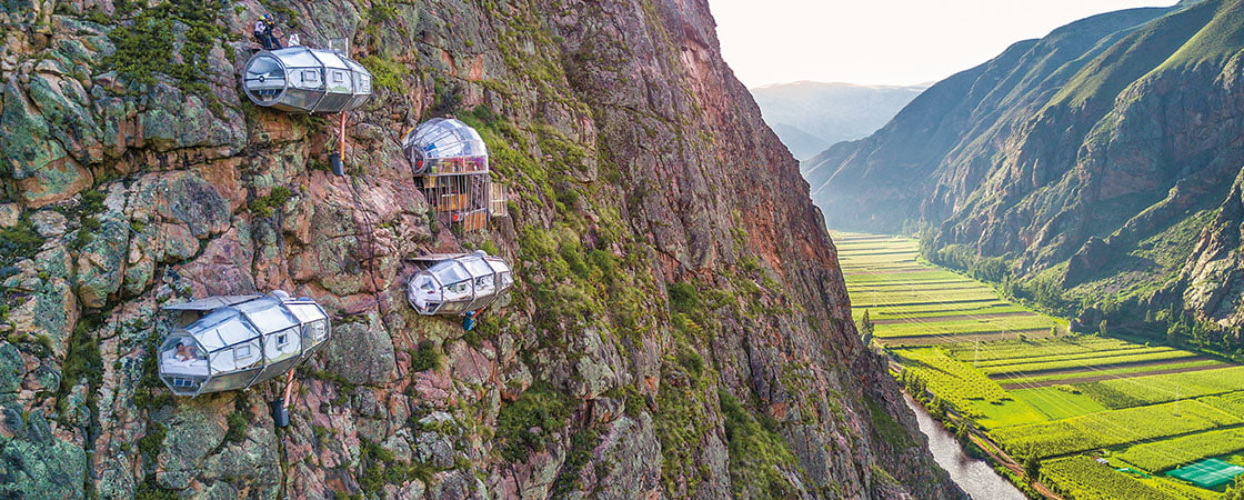 Photo of lodgings high on the side of a mountain